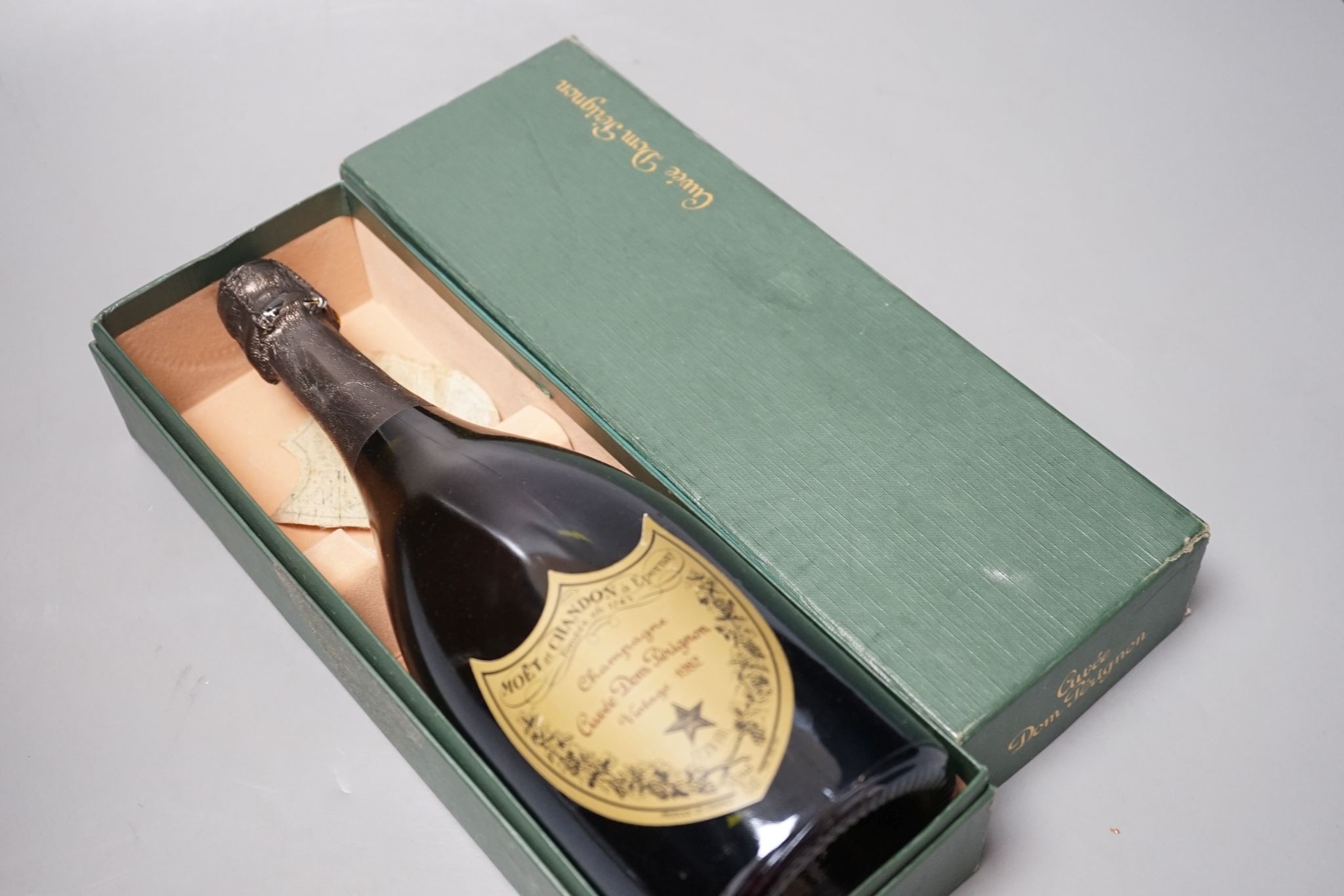 One boxed bottle of Dom Perignon vintage 1982 Champagne.